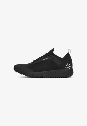 Black athletic shoes with a breathable mesh upper, textured design, rubber outsole, and reflective logo accents.