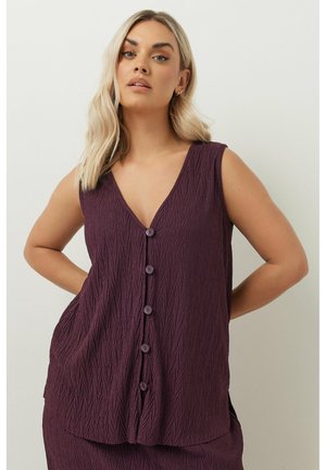 Top senza maniche a scollatura a V in un tessuto viola scuro testurizzato, con un'apertura frontale con bottoni e tasche laterali, caratterizzato da un silhouette a trapezio.