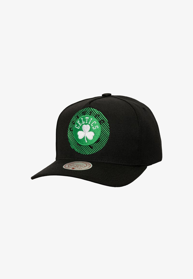 Black baseball cap featuring a circular green embroidered logo with a shamrock and "Celtics" text, textured striped background, and flat brim.