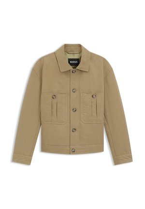 Rudos spalvos medvilninis švarkelis su apykakle, ilgomis rankovėmis ir dviem priekinėmis kišenėmis su sagomis. Vidaus pusėje matoma prekės ženklo etiketė.