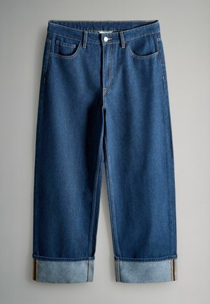 Dark blue denim jeans with a relaxed fit, featuring a cuffed hem, four pockets, and contrast stitching. Smooth texture without embellishments.