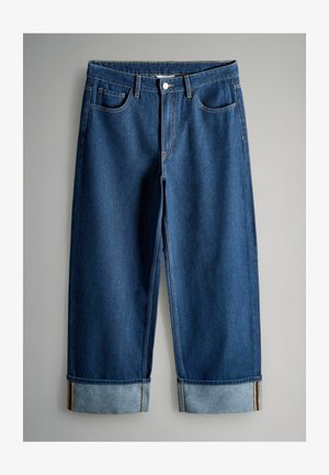 Dark blue denim jeans with a relaxed fit, featuring a cuffed hem, four pockets, and contrast stitching. Smooth texture without embellishments.