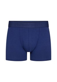 Navy blue cotton boxer briefs with an elastic waistband featuring embossed "Resteröds" branding. Smooth texture and fitted design.