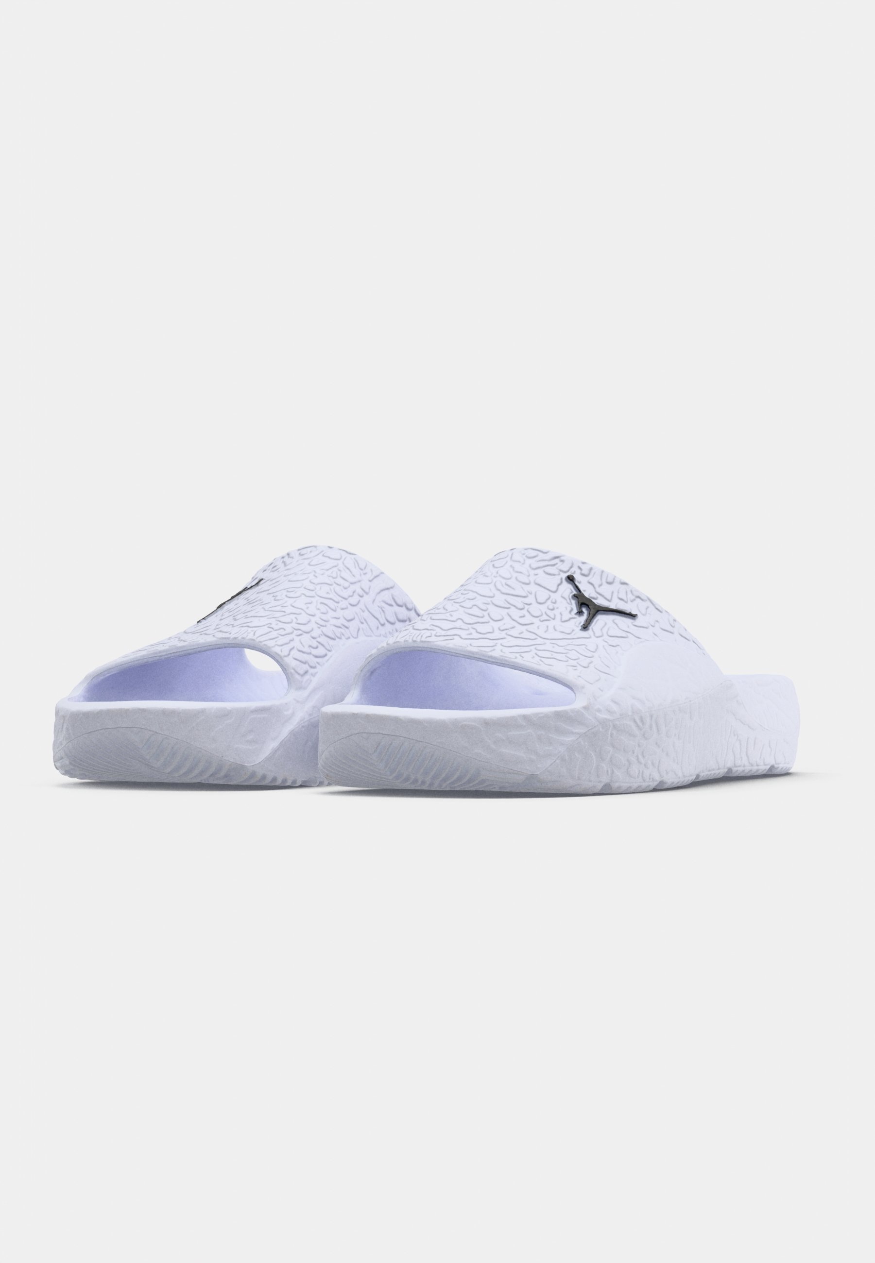 white and blue jordan slides