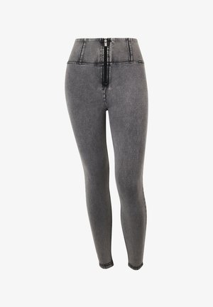 Korkeavyötäröiset harmaat denimin leggingsit, joissa on etuvetoketju, kapeahko istuvuus ja sileä pinta sekä saumojen varrella olevat tikatut yksityiskohdat.