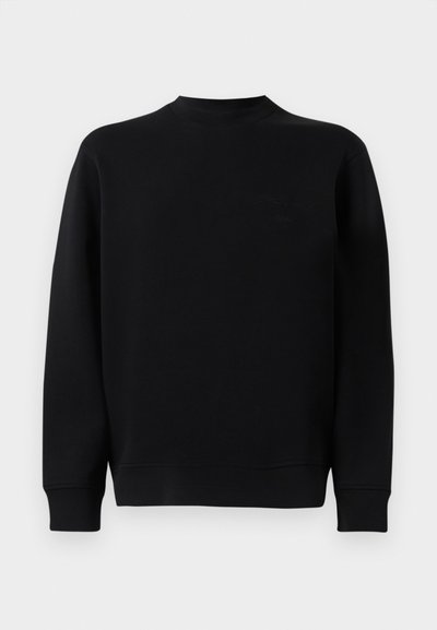 Sweatshirt preto com gola redonda, mangas longas e uma textura suave. Apresenta um logo discreto no peito e um corte descontraído.