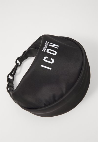 Mustvalge, ümmargune ristiõlgade kott, mis on valmistatud tekstuuriga kangast, varustatud õlarihmaga, millel on klammerduv kinnitus, kus on trükitud "ICON" ja brändinimi.