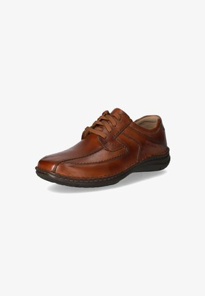 Brown leather shoe with a rounded toe, lace-up design, contrasting stitching, and a slightly textured surface and rubber sole.