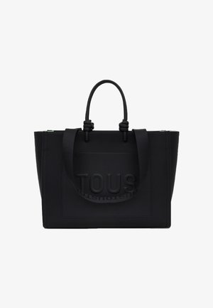 Borsa tote rettangolare nera con due manici corti ad anello, una tracolla regolabile e logo "TOUS" in rilievo sul pannello frontale.