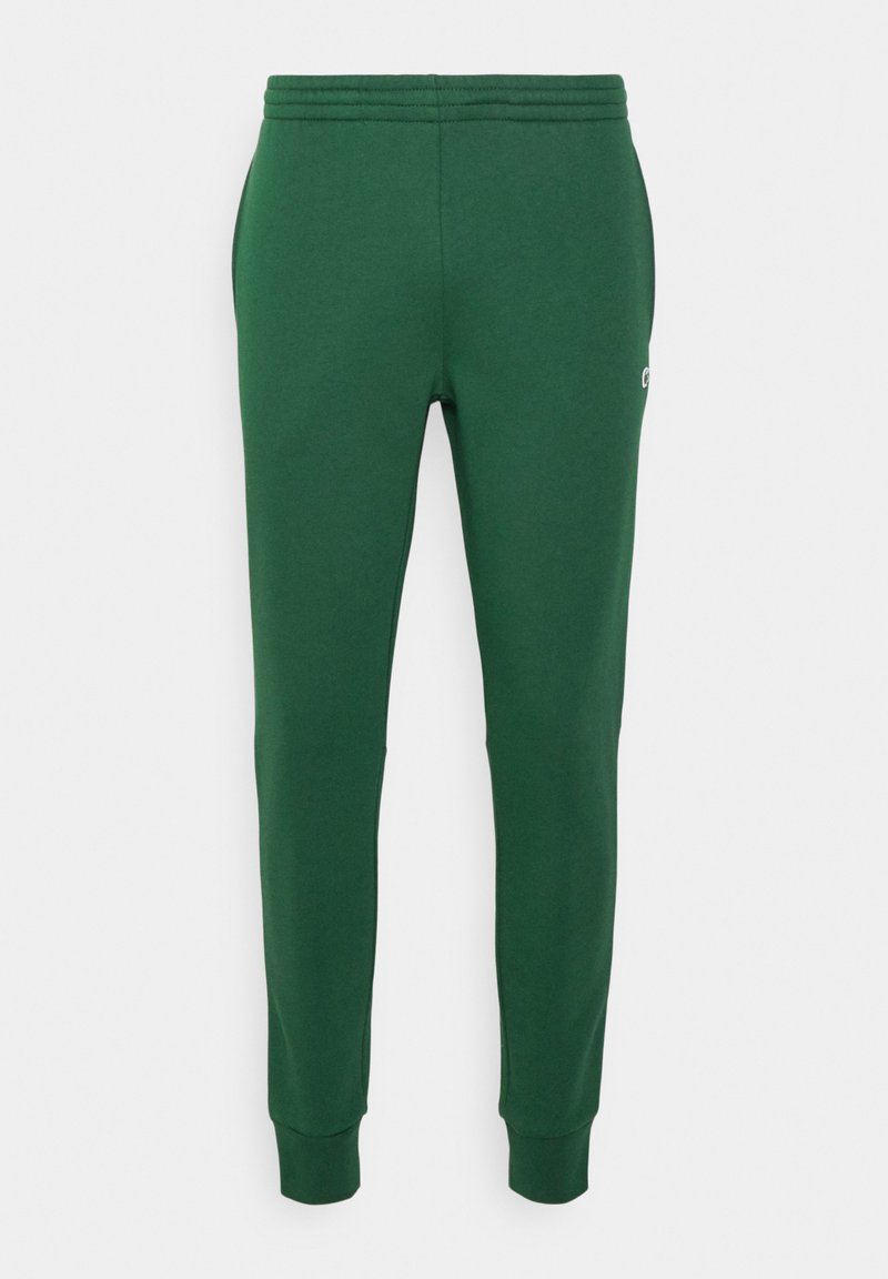 Pantalons de survêtement verts en mélange de coton doux, avec une coupe fuselée, taille élastique, poches latérales et un petit logo.