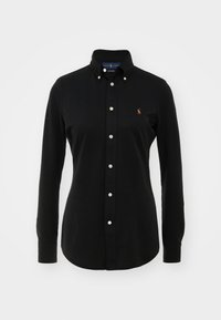 Chemise noire à manches longues boutonnée avec col boutonné et petit logo brodé sur la poitrine gauche.