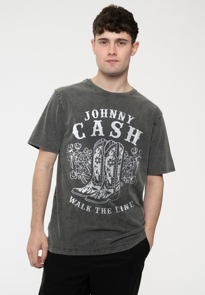 Gray cotton t-shirt featuring a vintage Johnny Cash graphic design with cowboy boots and floral accents. Crew neck and short sleeves.
