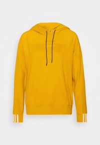 Gul huva sweatshirt med svarta snoddar, ribbade ärmslut, sidsömmar och vita tre-rands detaljer på ärmarna. Mjuk tygtextur.