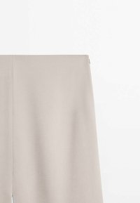 Beige fabric trousers with a high waist and smooth texture, featuring a concealed zipper and no visible patterns or embellishments.
