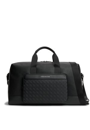 Czarna skórzana torba duffel z teksturowaną przednią kieszenią, krótkimi uchwytami, regulowanym paskiem na ramię i logo Tommy Hilfiger na kieszeni.