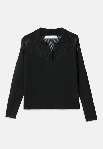 Black long-sleeve polo shirt featuring a textured upper, ribbed collar, three-button placket, and a relaxed fit.