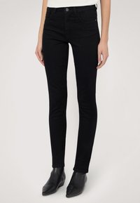 Schwarze, hoch geschnittene Skinny Jeans aus Denim, mit einem Frontknopfverschluss, zwei Seitentaschen und einer schlanken Passform.