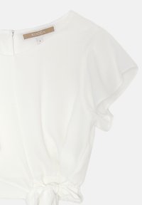 Top bianco a maniche corte con scollo rotondo, vita elastica e dettaglio con nodo in basso. Realizzato in un tessuto morbido e leggero.