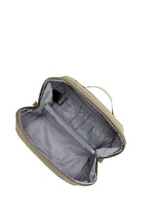 Beżowa torba z zamkiem błyskawicznym o miękkiej powierzchni, z szarym wnętrzem, jedną kieszenią na zamek oraz elastycznymi przegrodami do organizacji.