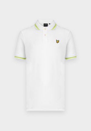 Valge polo-särk roheliste triibuliste krae ja varrukatega. Rinnal kollane tikitud logo. Valmistatud siledat kangast.