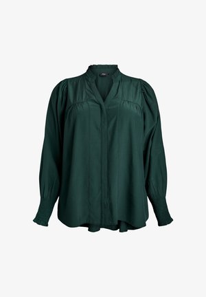 Donkergroene blouse met een V-hals, pofmouwen en gerimpelde manchetten. Gemaakt van een gladde stof, met een ontspannen pasvorm en subtiele plooien.