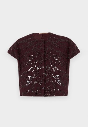 Short sleeve cropped jacket in dark burgundy with shiny black and silver sequins forming a floral pattern on textured fabric.