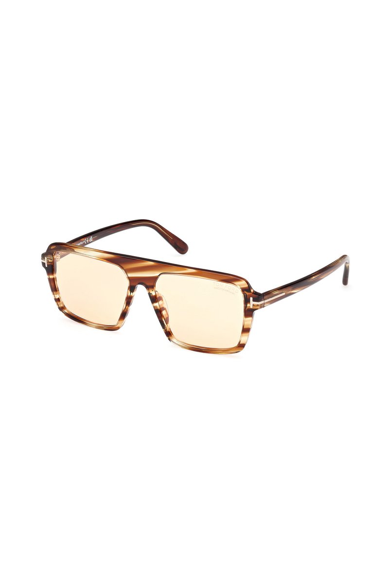 Ochelari de soare tortoise brown cu rame pătrate și lentile galbene deschise, având brațe subțiri cu un finisaj lucios. Design distinctiv stratificat.