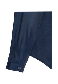 Camicia blu navy con maniche lunghe e polsini con bottone, dalla texture liscia e dalla linea classica. Dettagli di cucitura delicati lungo la cucitura.