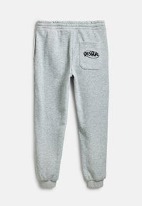 Šedé tepláky vyrobené z měkkého materiálu, s přiléhavým designem, elastickými manžetami a zadní kapsou s logem "Desigual".