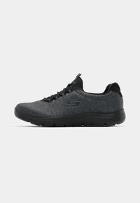Gray athletic shoe with a textured upper, black accents, and a lightweight sole. Features lace-up design and a rounded toe shape.