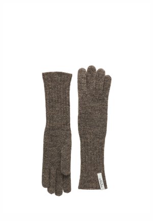 Pair of long brown knitted gloves with ribbed texture, one showing a small white fabric label.