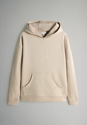 Beige hoodie med en framficka, dragsko i huvan, långa ärmar och ribbade muddarna. Slätt tyg med en avslappnad passform och minimalistisk design.