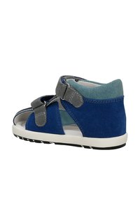 Blue and gray toddler sandal with open toe, two adjustable hook-and-loop straps, and white rubber sole.