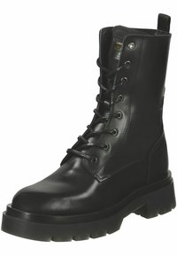 Black leather ankle boots with a round toe, five eyelets, and texture detailing. Thick rubber lug sole for traction. Smooth finish.