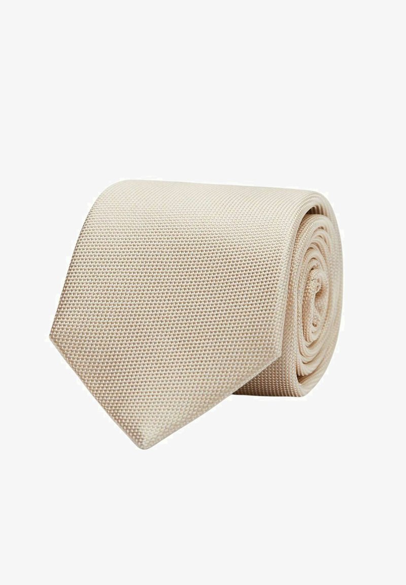 Beige texturerat slips, rullad med en spetsig ände. Tyget har ett vävt mönster som ger ett subtilt men distinkt utseende.