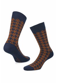 Brązowe i granatowe skarpetki w wzór houndstooth. Posiadają ściągacze i gładką, dzianinową fakturę. Logo na podeszwie.