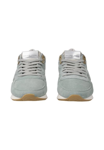 Light green suede sneakers with a textured finish, beige accents, and gray laces. Features a white foam midsole and rubber outsole.