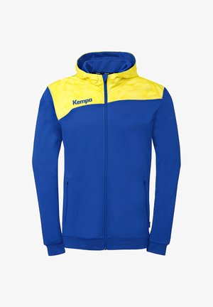 Veste de sport zippée bleu et jaune avec capuche, deux poches latérales et logo "Kempa" sur le panneau jaune de la poitrine.