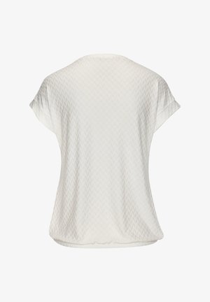 Lichtgewicht wit shirt met korte mouwen en een subtiele chevronstructuur. Ronde hals en een ontspannen pasvorm. Zachte stof met een vloeiende val.
