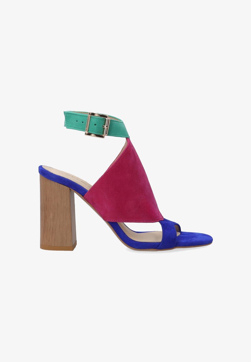 Multicolored heeled sandal featuring a pink suede upper with a green ankle strap and a blue toe strap. Block wooden heel completes the design.