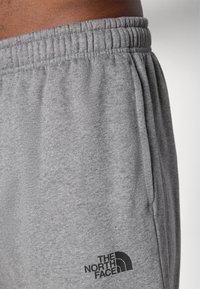 The North Face SIMPLE DOME REGULAR TAPERED JOGGER - Tracksuit bottoms - medium grey heather