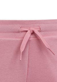 Vita in maglia rosa con coulisse tono su tono annodata a fiocco. Il tessuto ha una texture liscia con un delicato motivo a coste.