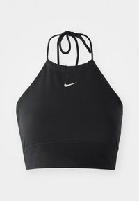 Black halter crop top made from stretch fabric, featuring a subtle white Nike logo, with a tie closure and a seamless finish.