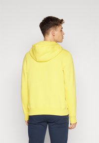 Tommy Hilfiger LOGO HOODY - Felpa con cappuccio - eureka yellow