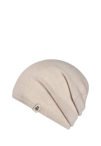 Light beige knitted beanie with a soft texture, slouchy design, and a small logo tag on the side. Smooth, seamless appearance.