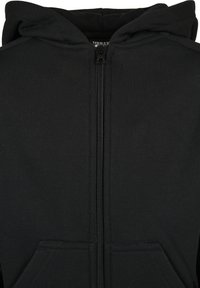 Hoodie zippé noir en mélange de coton, avec une fermeture éclair devant et deux poches avant. Texture lisse avec une capuche doublée.