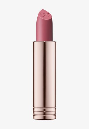 Rossetto in un tubo metallico color oro rosato. Il bullet è di un morbido colore rosa con una punta affusolata che presenta un logo in rilievo.
