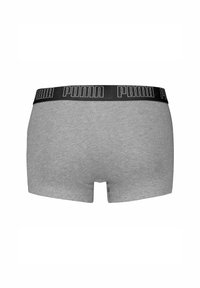 Boxer in grigio realizzati in tessuto morbido, con una fascia elastica nera sulla vita che presenta il logo "PUMA" in lettere bianche.
