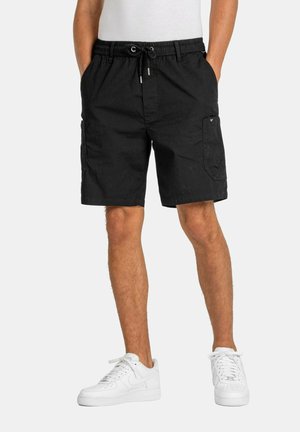 Black cargo shorts with an elastic waistband, drawstring, side pockets, and a patch pocket on the right leg. Smooth, lightweight fabric.