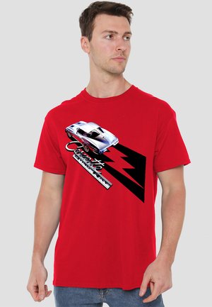 Red short-sleeve t-shirt featuring a silver sports car graphic, black angular accents, and "Corvette" text in white below the design.